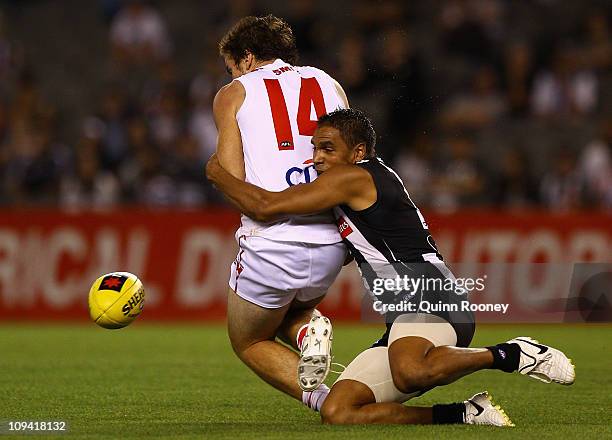 Andrew Krakouer of the Magpies tackles Craig Bird of the Swans during the NAB Cup Quarter Final match between the Collingwood Magpies and the Sydney...