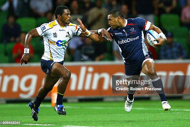Cooper Vuna of the Rebels is tackled during the round two Super Rugby match between the Melbourne Rebels and the Brumbies at AAMI Park on February...