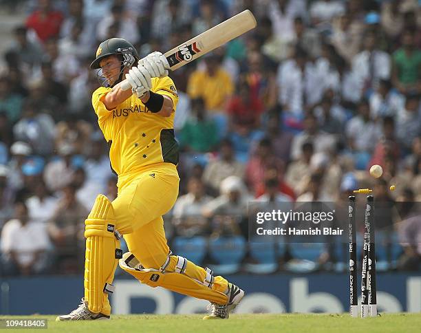 Shane Watson of Australia is bowled by Hamish Bennett of New Zealand during the 2011 ICC World Cup Group A match between Australia and New Zealand at...