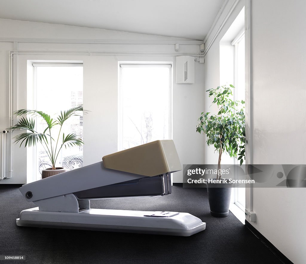 Giant Stapler On The Floor Inside Office Building High-Res Stock Photo ...