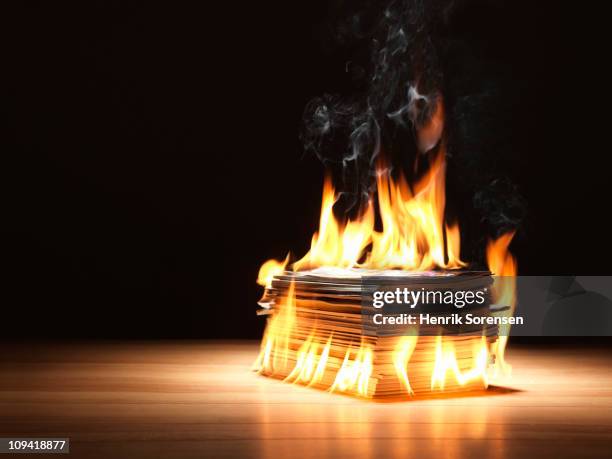 pile of old magazines on fire - burns stock pictures, royalty-free photos & images