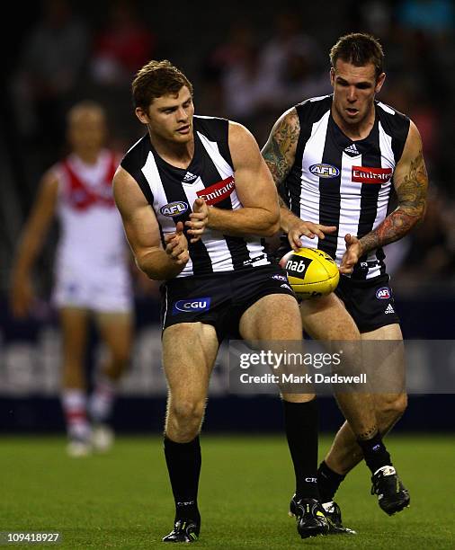 Dane Swan of the Magpies juggles a mark during the NAB Cup Quarter Final match between the Collingwood Magpies and the Sydney Swans at Etihad Stadium...