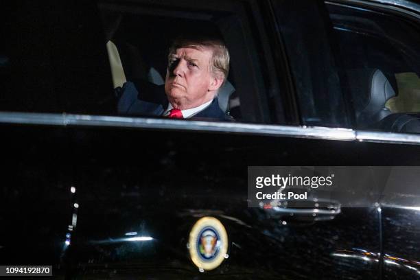 President Donald Trump sits in the presidential limo as he departs the White House for Capitol Hill, where he will deliver his second State of the...