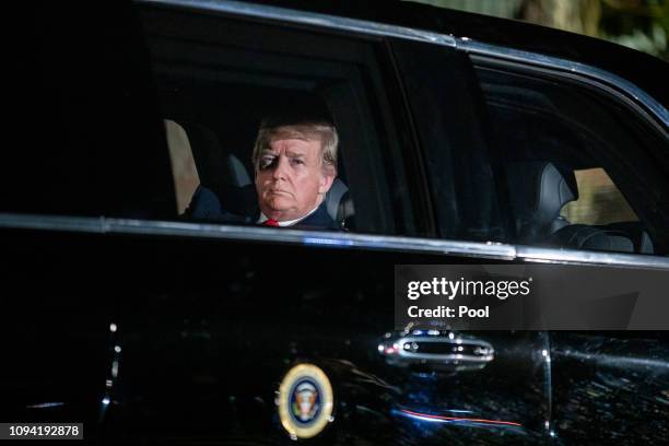 President Donald Trump sits in the presidential limo as he departs the White House for Capitol Hill, where he will deliver his second State of the...