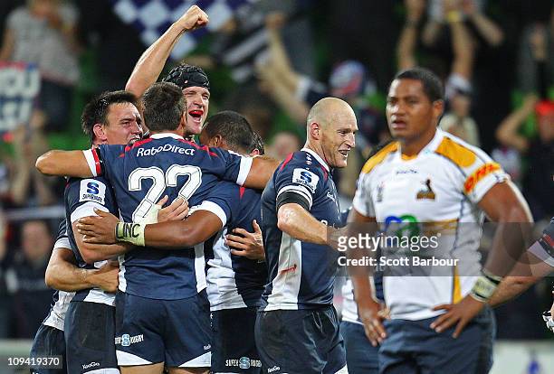 The Rebels celebrate at the full time whistle after the round two Super Rugby match between the Melbourne Rebels and the Brumbies at AAMI Park on...