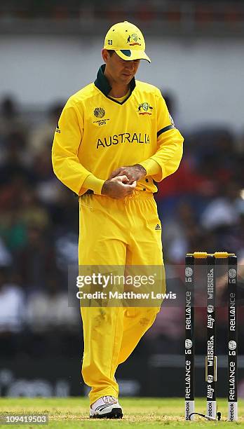 Ricky Ponting, Captain of Australia holds his injured finger during the 2011 ICC World Cup Group A match between Australia and New Zealand at...