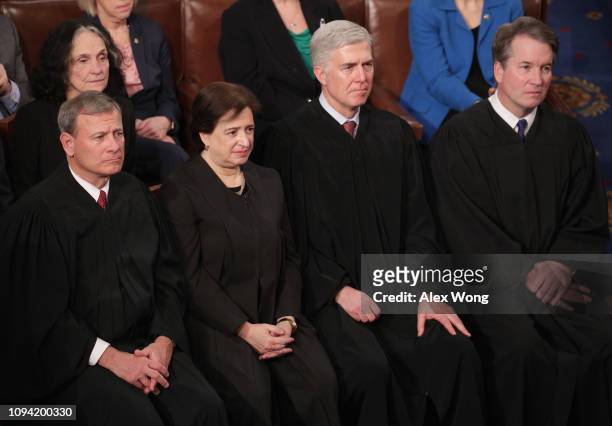 Supreme Court Justices John Roberts, Elena Kagan, Neil Gorsuch, and Brett Kavanaugh look on as President Donald Trump delivers the State of the Union...