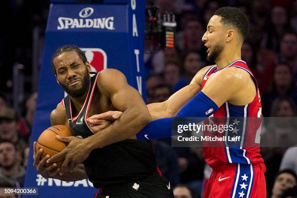 Toronto Raptors Fight Kawhi Leonard of the Toronto Raptors fights for the ball with Ben ...