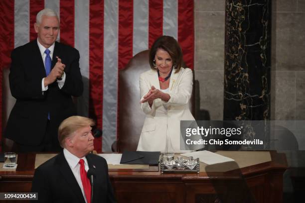 Speaker Nancy Pelosi and Vice President Mike Pence applaud President Donald Trump at the State of the Union address in the chamber of the U.S. House...