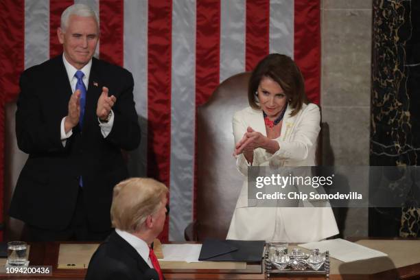 Speaker Nancy Pelosi and Vice President Mike Pence applaud President Donald Trump at the State of the Union address in the chamber of the U.S. House...