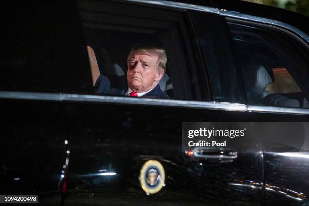 President Donald Trump sits in the presidential limo as he departs the White House for Capitol Hill, where he will deliver his second State of the...