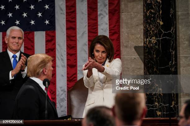 Speaker Nancy Pelosi and Vice President Mike Pence applaud U.S. President Donald Trump at the State of the Union address in the chamber of the U.S....