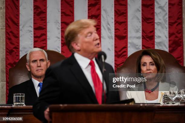 Speaker Nancy Pelosi and Vice President Mike Pence look on as U.S. President Donald Trump delivers the State of the Union address in the chamber of...