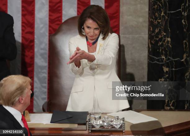 Speaker Nancy Pelosi greets President Donald Trump just ahead of the State of the Union address in the chamber of the U.S. House of Representatives...