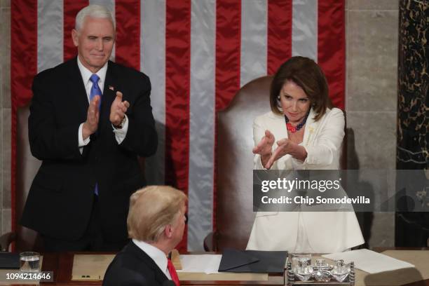 Vice President Mike Pence and Speaker Nancy Pelosi greet President Donald Trump just ahead of the State of the Union address in the chamber of the...