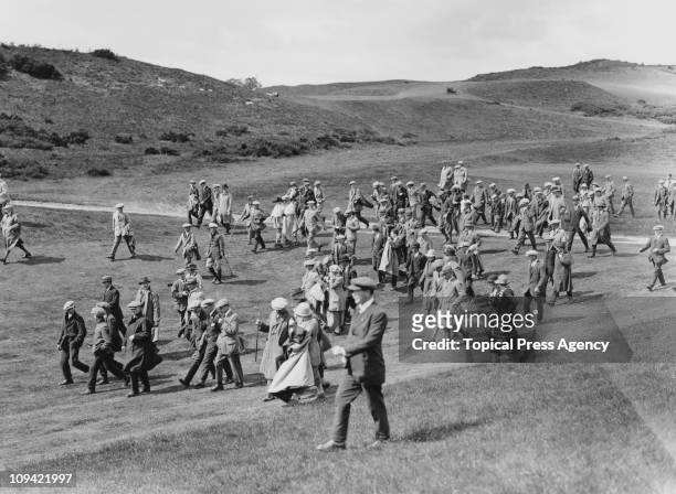 Spectators walking the course during the 1000 Guineas golf tournament at Gleneagles, Scotland, June 1922.