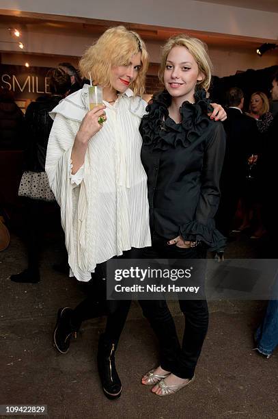 Tabitha Denholme and Cory Kennedy attend the Private view of Queen: stormtroopers In Stilettos on February 24, 2011 in London, England.