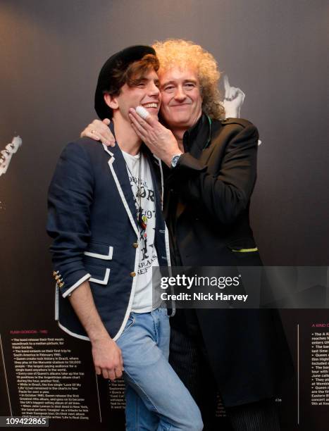 Mika and Brian May attend the Private view of Queen: stormtroopers In Stilettos on February 24, 2011 in London, England.