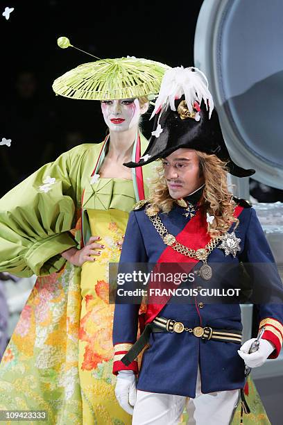 British designer John Galliano acknowledges the public at the end of Christian Dior's Spring-Summer 2007 Haute Couture collection in Paris, 22...