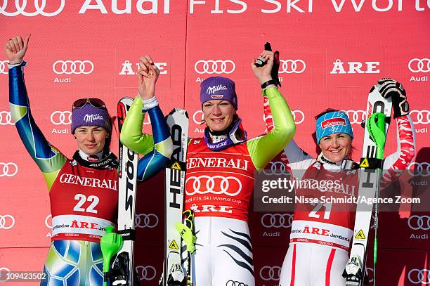 Maria Riesch of Germany takes 1st place, Tina Maze of Slovenia takes 2nd place, Elisabeth Goergl of Austria takes 3rd place during the Audi FIS...