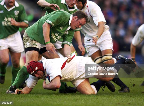 Phil Vickery of England is tackled by Mick Galwey of Ireland during the Lloyds TSB Six Nations Championship match played at Twickenham, in London....