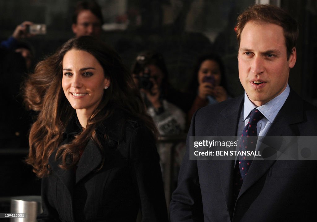 Britain's Prince William (R) and his fia