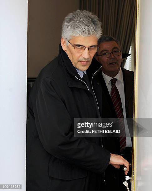 Tunisian international Cooperation minister Nouri Jouini and Tunisian defence minister Abdelkarim Zebidi leave after a cabinet meeting at the...