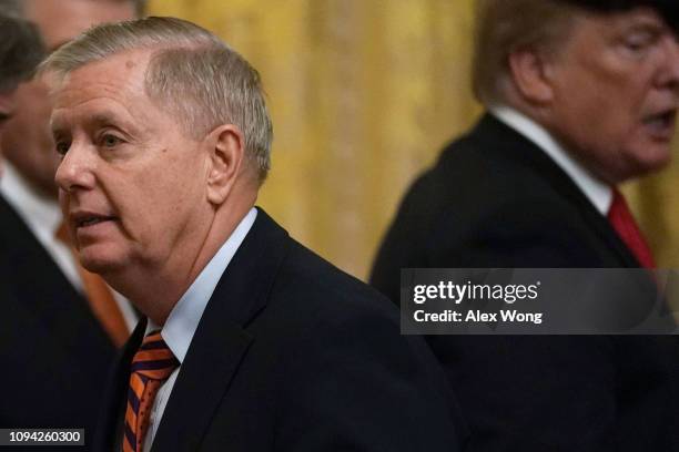 President Donald Trump and Sen. Lindsey Graham during an East Room event to host the Clemson Tigers football team at the White House January 14, 2019...