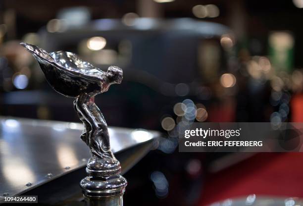 Picture shows the bonnet ornament of a 1911 Rolls-Royce Silver Ghost displayed during the Retromobile auto show in Paris on February 5, 2019. - A...