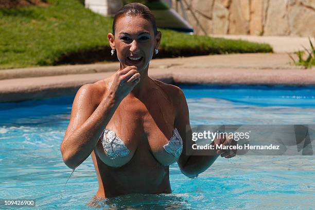 Argentine model Andrea Dellacasa, the Queen of the 52th International Song Festival, during a photo shoot in the pool of a hotel on February 25, 2011...