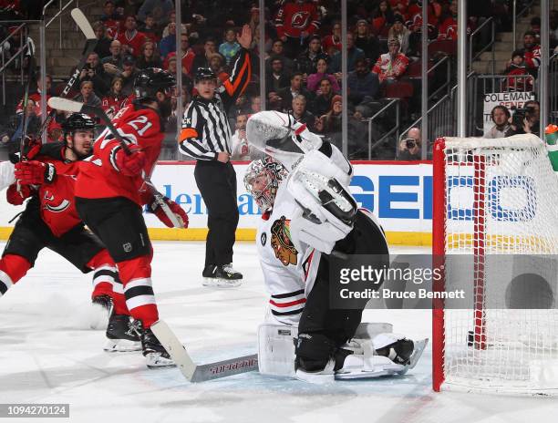 Kyle Palmieri of the New Jersey Devils scores at 5:16 of the second period against Cam Ward of the Chicago Blackhawks at the Prudential Center on...