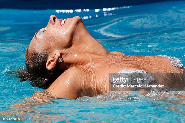 Argentine model Andrea Dellacasa, the Queen of the 52th International Song Festival, during a photo shoot in the pool of a hotel on February 25, 2011...