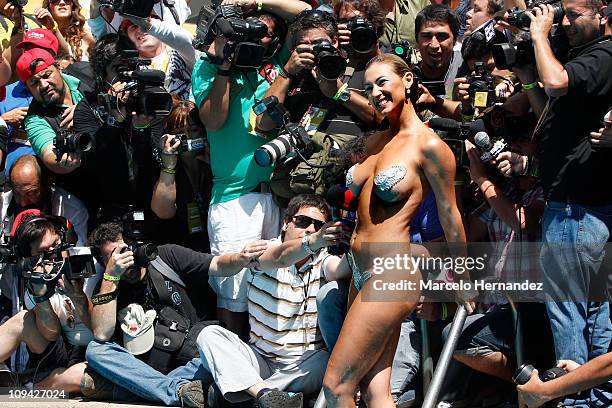 Argentine model Andrea Dellacasa, the Queen of the 52th International Song Festival, during a photo shoot in the pool of a hotel on February 25, 2011...