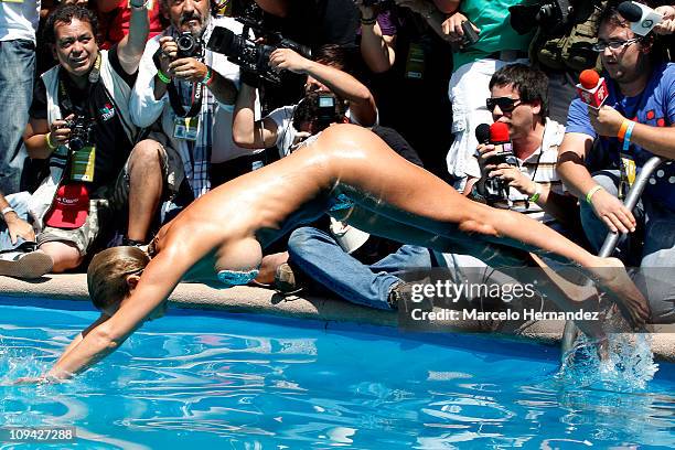 Argentine model Andrea Dellacasa, the Queen of the 52th International Song Festival, during a photo shoot in the pool of a hotel on February 25, 2011...