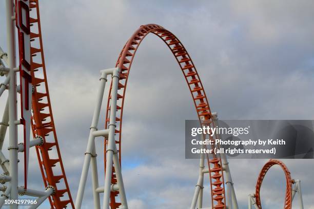 visual building blocks: graphic image of found patterns and shapes of a metal amusement park ride under an expansive sky - anticipation rollercoaster stock pictures, royalty-free photos & images