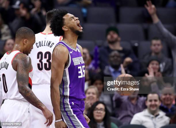 Marvin Bagley III of the Sacramento Kings reacts after dunking the ball against the Portland Trail Blazers at Golden 1 Center on January 14, 2019 in...