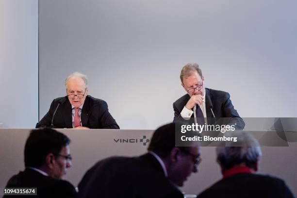 Xavier Huillard, chief executive officer of Vinci SA, left, speaks beside Christian Labeyrie, chief financial officer of Vinci SA, during the...