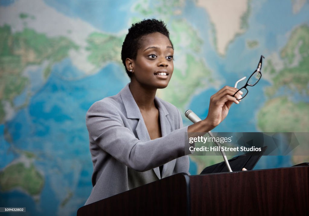 African American businesswoman talking at podium