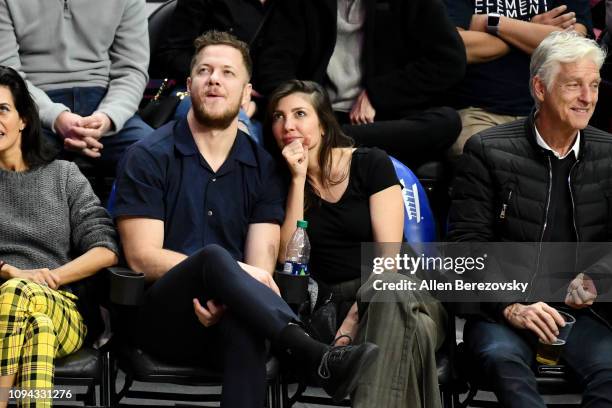 Musicians Dan Reynolds of Imagine Dragons and Aja Volkman attend a basketball game between the Los Angeles Clippers and the New Orleans Pelicans at...