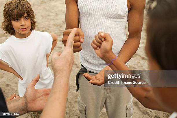 boys doing rock, paper, scissors - rock paper scissors stock pictures, royalty-free photos & images