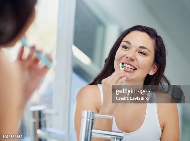 sparkly teeth, sparkly day - adult in mirror stock pictures, royalty-free photos & images