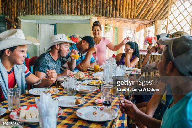 casual daytime dinner party - viñales cuba stock pictures, royalty-free photos & images