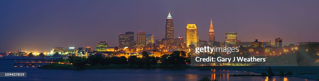 USA, Ohio, Cleveland, City skyline illuminated at dusk