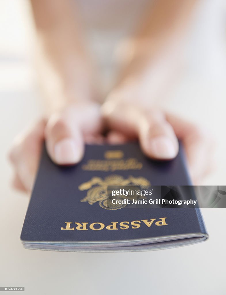 USA, New Jersey, Jersey City, Close-up view of woman's hands holding US passport