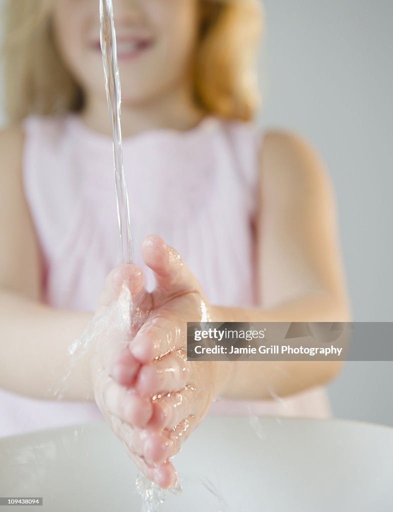 USA, New Jersey, Jersey City, Close-up view of girl (8-9) washing hands