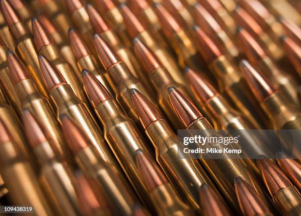 pile of bullets - ammunition stock pictures, royalty-free photos & images