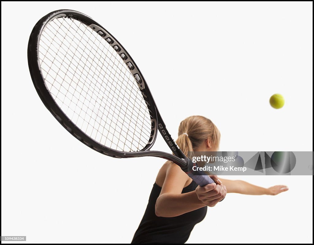 Young woman playing tennis