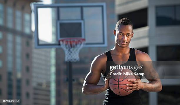 usa, utah, salt lake city, basketball player holding basketball - vest stock pictures, royalty-free photos & images