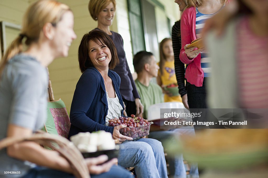 Girls (10-11,14-15) with mother and family  during celebration event