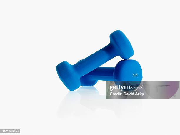 studio shot of blue dumpbells - dumbbell stock pictures, royalty-free photos & images